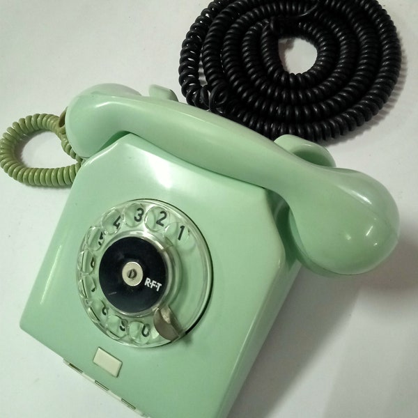 Working rotary telephone of the Soviet era.Vintage blue bakelite telephone.Stationary Soviet telephone Nordfern. Retro telephone of the GDR.