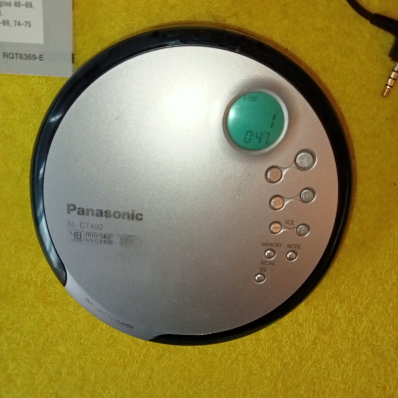 May include: A silver Panasonic SL-CT490 CD player with a green digital display showing 0:47. The player has buttons for volume, memory, mode, and recall.