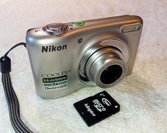Silver working camera Nikon Coolpix L25, 10.1 MP with 5x optical zoom, elegant digital camera, memory card