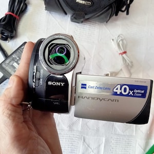 In working digital video camera Sony DCR-DVD106E ,PAL ,Handycam Carl Zeiss Vario-Tessar,optical zoom 40x, 2000x , DVD disc, flash drive