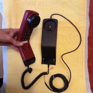 Working phone on the wall.Retro dial telephone Siemens wall red Telepone Germany 80s Vintage telephone Siemens FeAp3712, USSR era