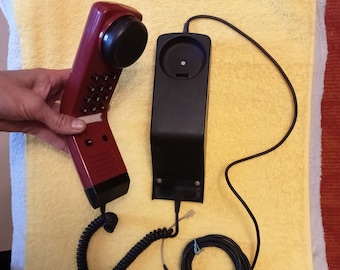 Working phone on the wall.Retro dial telephone Siemens wall red Telepone Germany 80s Vintage telephone Siemens FeAp3712, USSR era