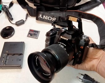 Working SLR camera Sony Alpha DSLR-A100, lens 0.38/ 1.3ff macro, DT 3.5-5.6/18-70, optical zoom, charger, memory card, battery, bag