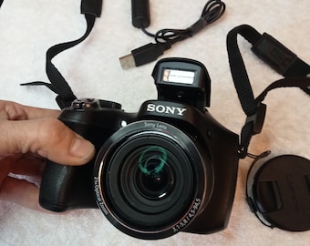 Sony Cybershot DSC-H100, Sony Lens optics, camera, 21x zoom, HD video, 16.1 MP, stylish black camera, working, early 2000s digital camera