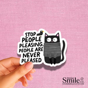 May include: A die-cut sticker featuring a black cat wearing a gray and black striped sweater, standing next to a small black bird. The text reads: STOP PEOPLE PLEASING. PEOPLE ARE NEVER PLEASED. The design has a white border and a matte finish.