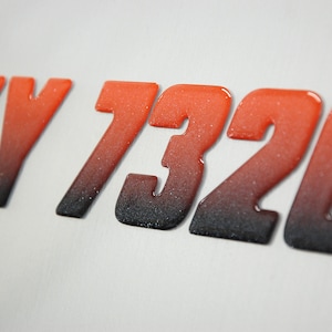 Boat Number Decals. Domed lettering with metallic finish. Sold as set of 2. Premium 3M boat lettering vinyl.