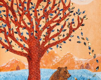 May include: An original artwork depicting a brown bear sitting under a red tree with blue and gold leaves. The background features mountains, a blue body of water, and a white sun. The artwork has a textured appearance and a warm color palette.
