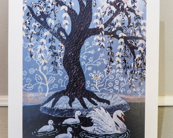 May include: A framed art print featuring a tree with a textured, dark brown trunk and branches, adorned with white and patterned leaves. The artwork depicts a swan and ducklings in a body of water, set against a blue background with floral accents.