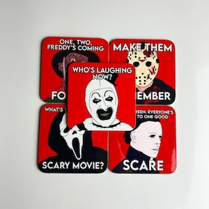 May include: Five square coasters with red backgrounds featuring horror movie characters. The coasters display illustrations of Freddy Krueger, Jason Voorhees, Art the Clown with the text WHO'S LAUGHING NOW?, Ghostface, and Michael Myers with text.