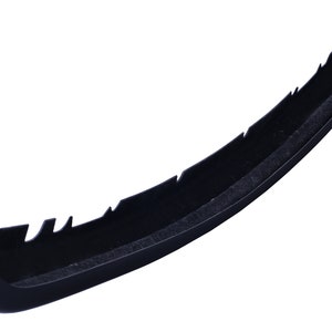 May include: Black plastic car bumper with a textured surface and a jagged edge.