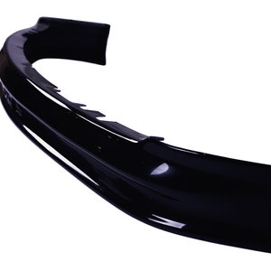 May include: A black plastic car bumper spoiler with a smooth, curved design.