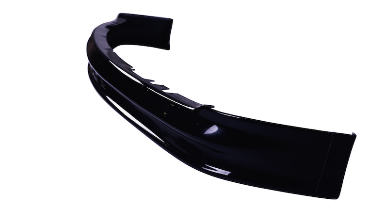 May include: A black plastic car bumper spoiler with a smooth, curved design.