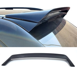 May include: A black car spoiler with a sleek, aerodynamic design. The spoiler is made of high-quality ABS plastic and is designed to improve the car's handling and performance.