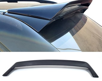 May include: A black car spoiler with a sleek, aerodynamic design. The spoiler is made of high-quality ABS plastic and is designed to improve the car's handling and performance.