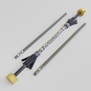 May include: A set of fire spinning props, including a fire staff with a patterned center and black tassels, and two additional practice staffs. The ends of the fire staff are wrapped with a yellow material.