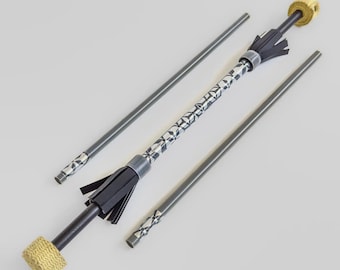 May include: A set of fire spinning props, including a fire staff with a patterned centre and black tassels, and two additional practice staffs. The ends of the fire staff are wrapped with a yellow material.