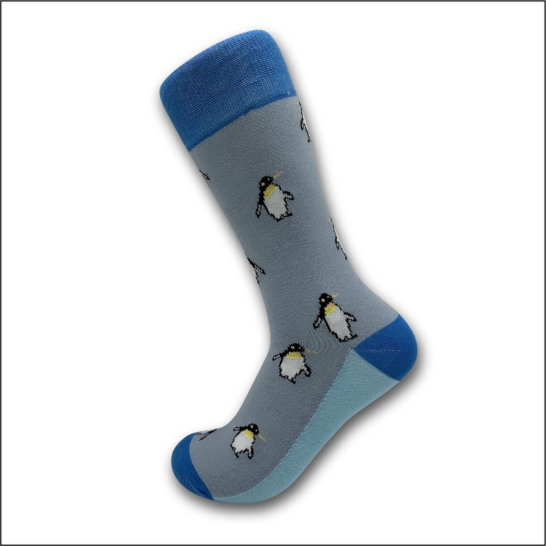 May include: A pair of blue and gray socks with a penguin pattern. The socks have a blue cuff and a gray body with white penguins.