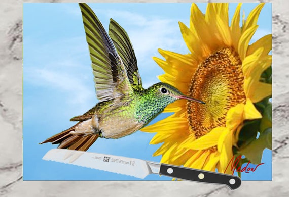 Hummingbird on Sunflower Glass Cutting Board . Use as a serving tray, cheese board and charcuterie board.