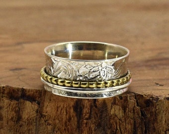 Zilveren ring met twee roterende ringen in goud en zilver