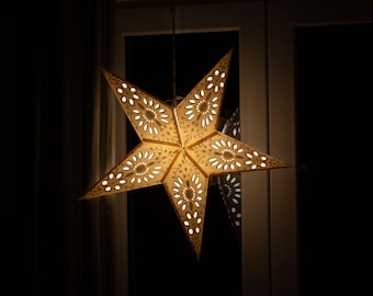 White paper star with glitter and floral design, Christmas star
