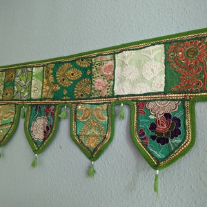 Indian door hanging made from recycled embroidered sari fabrics, patchwork door frame decoration, green