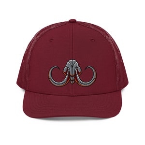 May include: A maroon trucker hat with a grey and red embroidered mammoth head design.