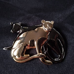 Liz Claiborne black and gold panther brooch