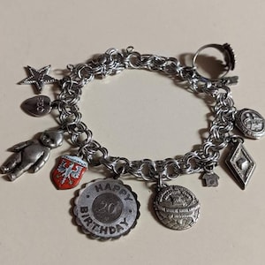 Sterling silver charm bracelet with eleven charms