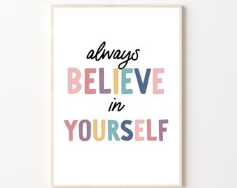 May include: A white framed print with the text "always BELIEVE in YOURSELF" in colorful letters. The letters are in shades of pink, purple, yellow, blue, and green.