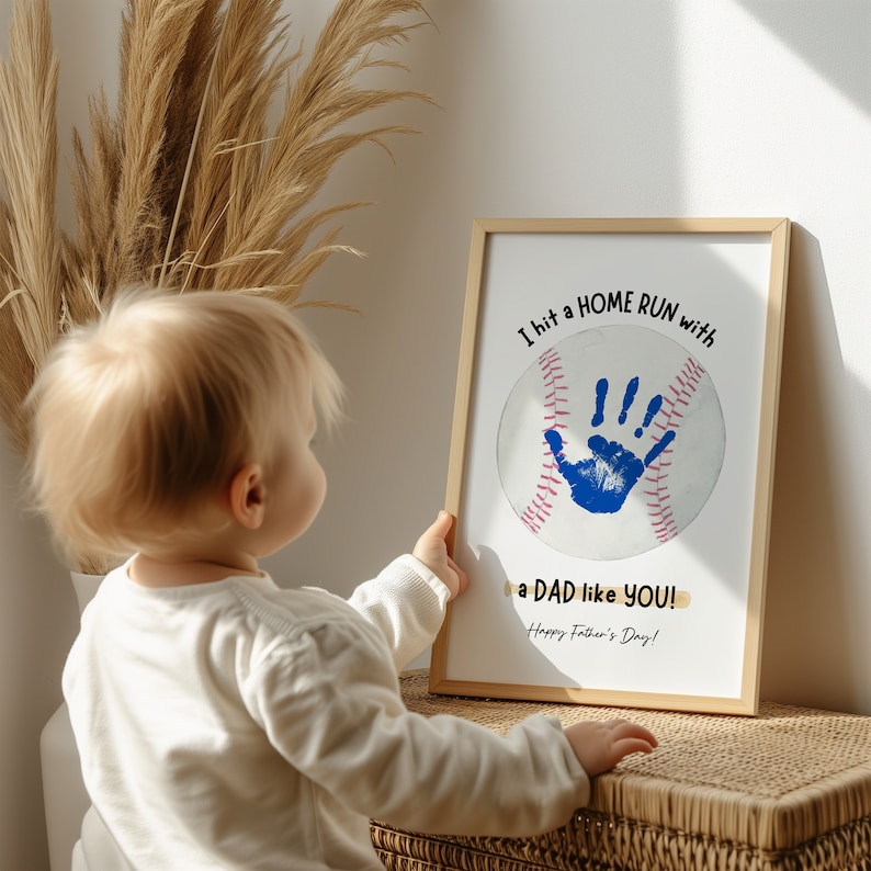 May include: A child's handprint on a baseball with the text "I hit a HOME RUN with a DAD like YOU! Happy Father's Day!"