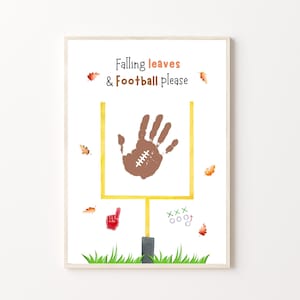 May include: A white printable sign with the text "Falling leaves & Football please" and a brown handprint inside a yellow football goalpost. There are also red, orange, and green leaves and a red hand with a finger pointing up.