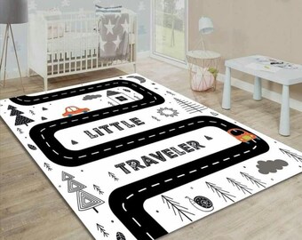May include: Black and white road rug with a red car, trees, and the words "Little Traveler".