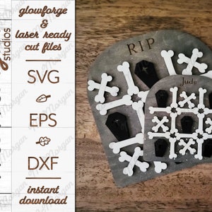 May include: A set of three wooden grave-themed decorations with white bones and black coffins. The largest decoration has the word "RIP" on it. The middle decoration has the word "Jude" on it. The decorations are on a wooden surface.