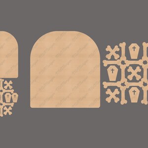 May include: A set of laser cut wooden Halloween decorations featuring a tombstone, a coffin, and a cross. The decorations are in a light brown colour and are ready to be painted or stained.