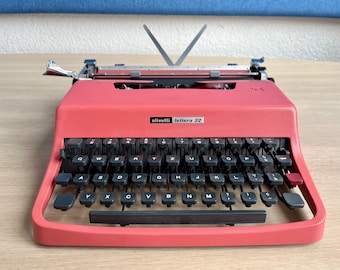 Rare pink 1972 Olivetti Lettera 32 portable typewriter