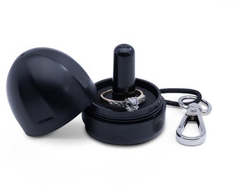 The Ring Thing–Black Onyx. Ring holder. Keep rings safe whenever you take them off. Waterproof. Clip to keychains, waterbottles & gym bags.