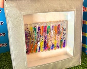 Cascada visual sensorial de juego suave con purpurina