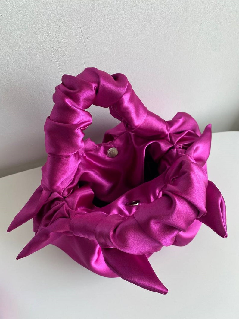 fuchsia leather handbag