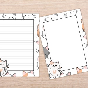 May include: Two printable stationery sheets with a white background and a border of cute cartoon cat faces. The cat faces are in various colors, including gray, white, orange, and pink. The left sheet has lined paper for writing. The right sheet has a blank space for writing.