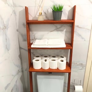 🚽 Over the Toilet Ladder Shelf – Small Space Bathroom Storage Organizer

Make the most of your bathroom with this stylish over toilet shelf, designed specifically for small space storage. This elegant toilet ladder shelf leans securely above your WC, offering vertical bathroom storage without drilling or wall damage — perfect for apartments and modern homes.