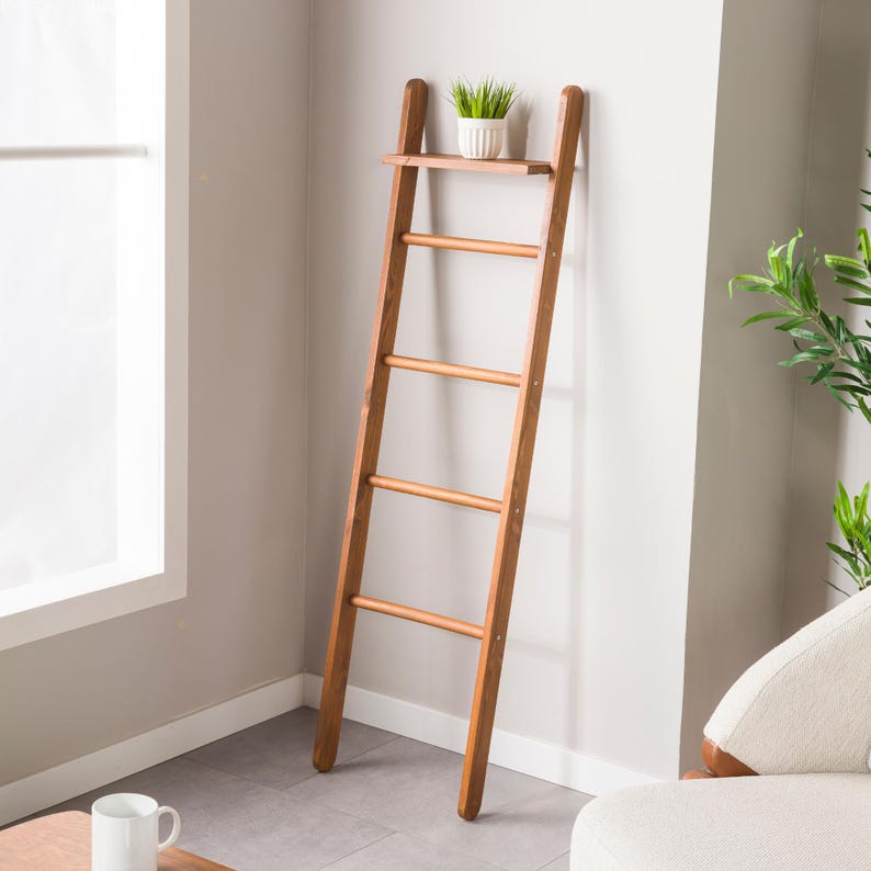 We combine the blanket ladder wood and blanket storage bathroom ladder wood  as a spacesave furniture. Here is designer towel rack ladder with plant stand farmhouse living room for your home!
