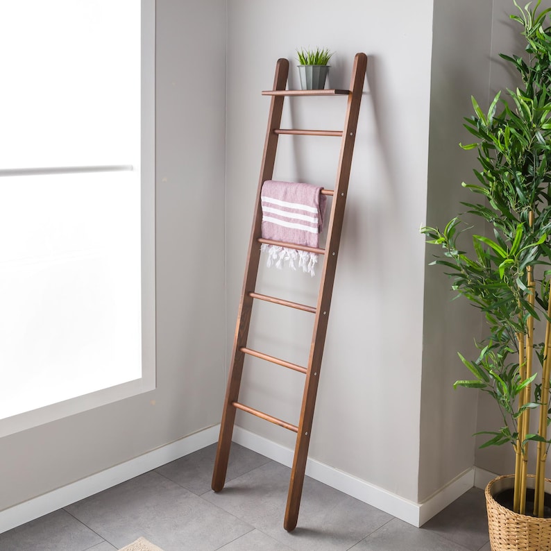 We combine the blanket ladder wood and blanket storage bathroom ladder wood  as a spacesave furniture. Here is designer towel rack ladder with plant stand farmhouse living room for your home!