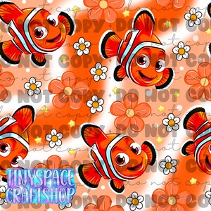 May include: A repeating pattern featuring orange clownfish with white stripes, large orange flowers, and small white daisies on a light orange background with white polka dots and small yellow stars. The text TINYSPACE CRAFTSHOP is visible.