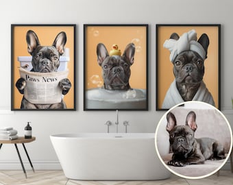 May include: Three framed prints featuring a black French Bulldog. One print shows the dog reading a newspaper titled "Paws News", another in a bathtub with a rubber duck, and the last wearing a towel. The prints have a light orange background.