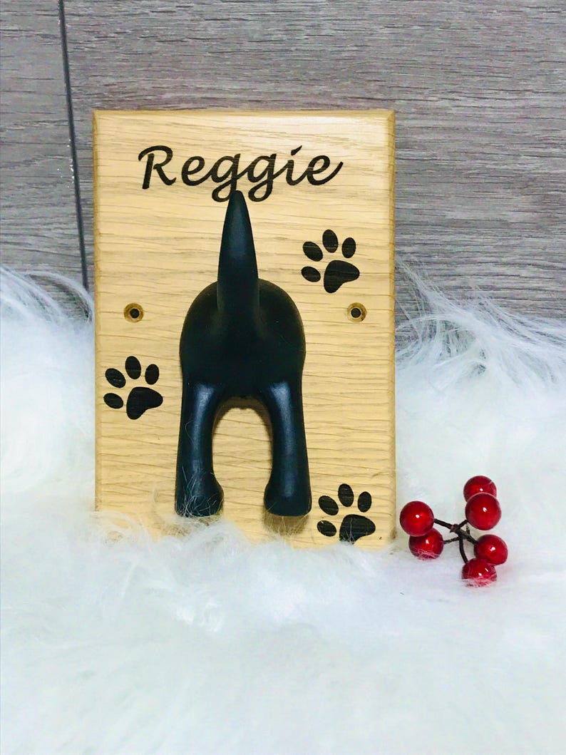 Solid Oak Board with a black rubber dog tail hook personalised with name and paw prints