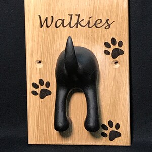 Solid Oak Board with a black rubber dog tail hook personalised with name and paw prints