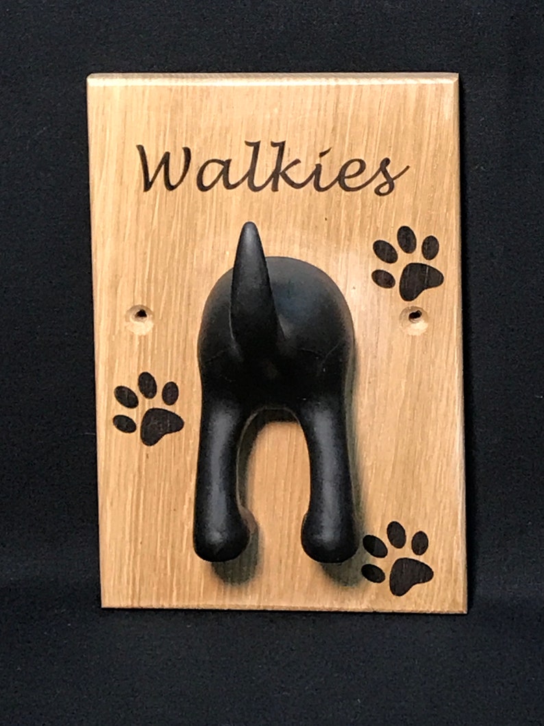 Solid Oak Board with a black rubber dog tail hook personalised with name and paw prints