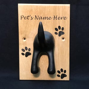 Solid Oak Board with a black rubber dog tail hook personalised with name and paw prints
