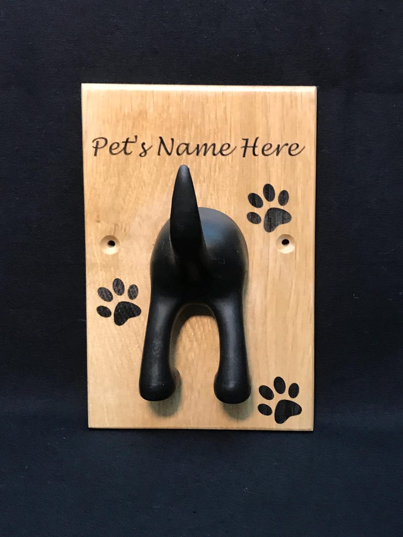 Solid Oak Board with a black rubber dog tail hook personalised with name and paw prints
