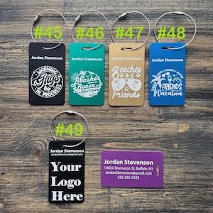 May include: Ten luggage tags with different designs. The tags are black, green, gold, blue, and purple. The tags have text that says "Warning Guy's Trip In Progress", "Beaches Booze and Besties", "Beaches Booze and Friends", "Friends Vacation", "Your Logo Here", and "Jordan Stevenson".